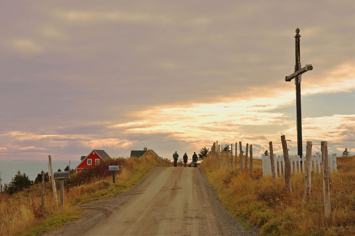 Three Walkers with a Roadside Shrine